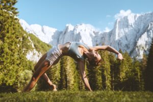 Female Practicing Yoga On Nature